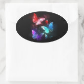 Drie golvende Butterflies op nachtachtergrond Ovale Sticker (Tas)