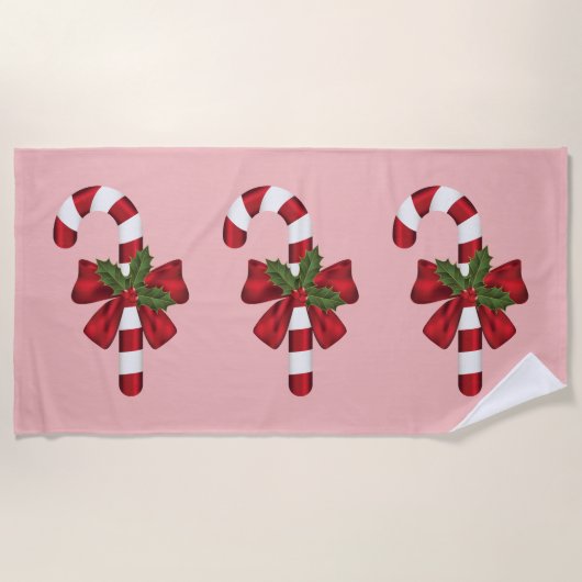 Drie Kerst Kerststokken Op Roze Strandlaken (Voorkant)