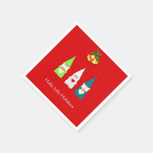 Drie kerstgnomen op rood servet (Hoek)