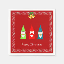 Drie kerstgnomen op rood servet