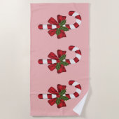 Drie kerstsnoepjes op roze strandlaken (Voorkant)