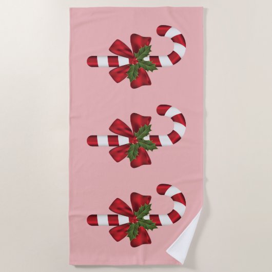 Drie kerstsnoepjes op roze strandlaken (Voorkant)