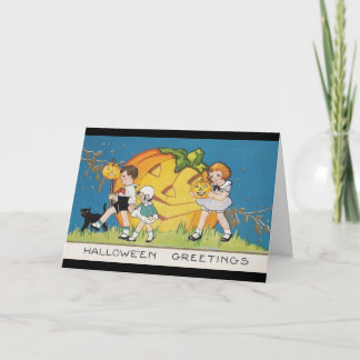 -drie-kleine-kinder-zwarte-kat-grote-pompoen kaart