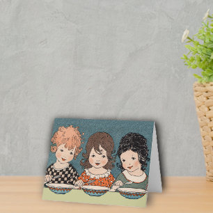 Drie kleine zusjes noteren kaart