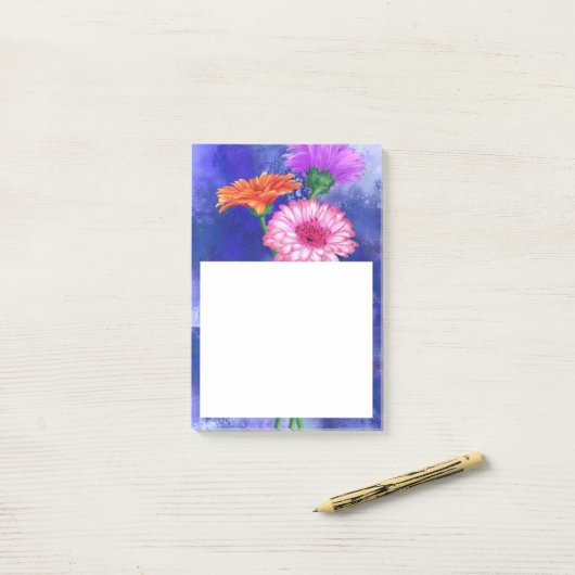 Drie kleuren Gerberas Post it Notes (Op bureau)