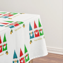 Drie kleurrijke kerstkabouters op wit tafelkleed