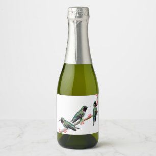 Drie kolibries neergestreken op een tak van een fl sparkling wijnetiket