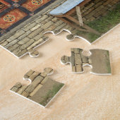 Drie mannen zitten op een bank bij de Memorial Cho Legpuzzel (Zijkant)