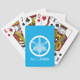 Drie paraplu's, verspringend in een cirkel pokerkaarten