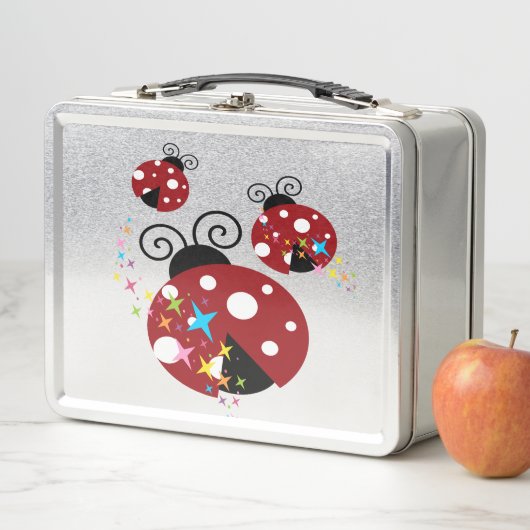 Drie rode en zwarte ladybug met sterren (In situ)