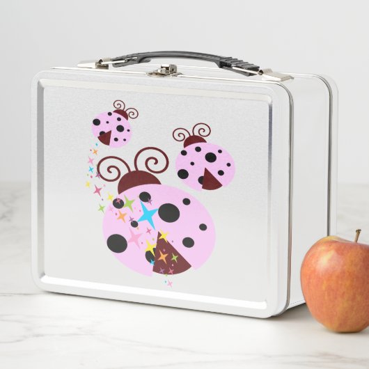 Drie roze en zwarte ladybug met sterren (In situ)