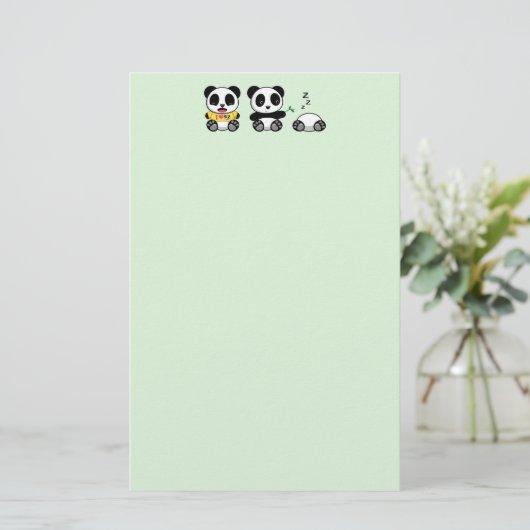Drie schattige kleine panda's op groen briefpapier (Staand voorkant)