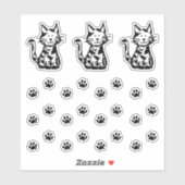 Drie stickers met pootafdrukken van zwart-witte ka (Vel)