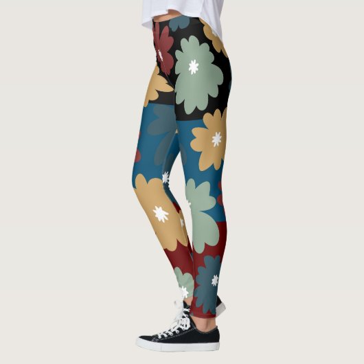 Drie tonerzwarte blauwe en geweerde bloemige kunst leggings (Links)