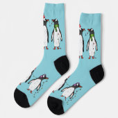 Drie vrolijke kerstpinguïns op lichtblauw sokken (Links)