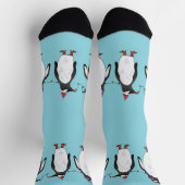 Drie vrolijke kerstpinguïns op lichtblauw sokken (Top)