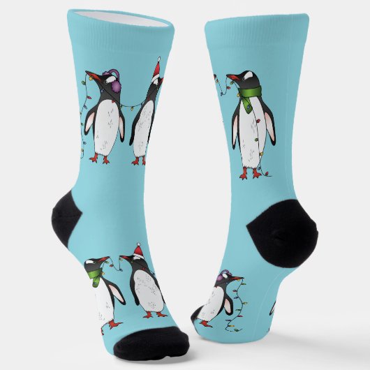 Drie vrolijke kerstpinguïns op lichtblauw sokken (Gebogen)