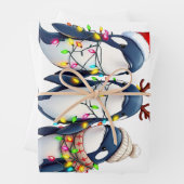 Drie walvissen dragen kerstmuts inpakpapier vel (In situ)