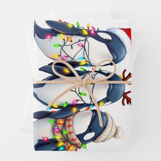 Drie walvissen dragen kerstmuts inpakpapier vel (In situ)