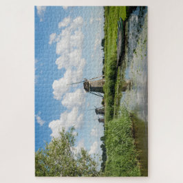 Drie windmolens en een kanaal met boten in Nederla Legpuzzel