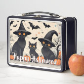 Drie zwarte katten met Petten op Halloween (In situ)