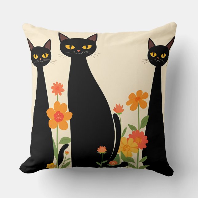 Drie zwarte katten tussen heldere bloemen kussen (Voorkant)