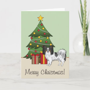 Driekleurige Papillon blije hond bij een kerstboom Kaart