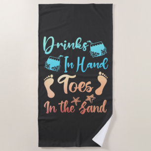 Drink in handspeelgoed in het zand - strand Gezegd Strandlaken