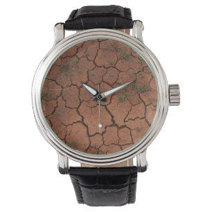 Droge, gebarsten grond horloge