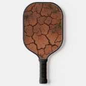 Droge, gebarsten grond pickleball paddle (Voorkant)