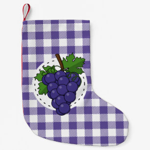 Druiven op witte violette geruite achtergrond kleine kerstsok