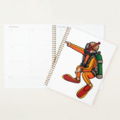 Duiker in oranje duikpak die wijst planner (Display)