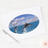 Duistere dolfijnen aan het spelen ovale sticker (Envelop)
