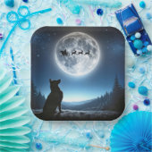 Duitse herder kijkt naar kerstman en rendier papieren bordje (Feest)