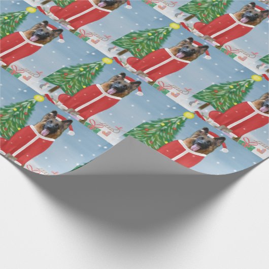 Duitse herderhond met kerstcadeaus in sneeuw cadeaupapier (Hoek)
