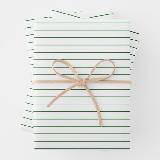 Dunne groene strepen op witte feestjes of kerstmis inpakpapier vel (In situ)