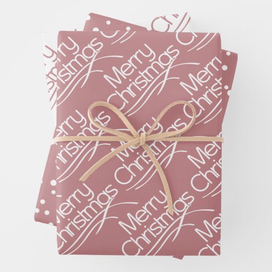 Dusty roos kersttypografie en stippen vakantie inpakpapier vel (In situ)