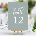 Dusty Sage minimalistische kalligrafie bruiloft Kaart<br><div class="desc">Verbeter uw huwelijksreceptie met ingetogen elegantie. Deze minimalistische tabelnummers bevatten een enkel woord,  "Table",  in delicate kalligrafie schrift op een kalmerende stoffige salie achtergrond. Het eenvoudige maar verfijnde ontwerp voegt een vleugje verfijning toe aan uw tafelsetting,  waardoor uw bloemstukken en andere inrichting kunnen schitteren.</div>