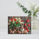 Easter bunny seated beside colorful eggs and tulip briefkaart (Staand voorkant)