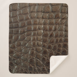 Echte bruine alligatorleder dicht bij show sherpa deken