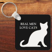 Echte mannen houden van zwarte en witte omkeerbare sleutelhanger (Voorkant)