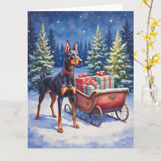 Edel Dobermann die Kerst slee bewaakt Winter Kaart (Gele Bloem)