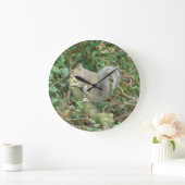 Eekhoorn met een oranje wandklok (Huis)