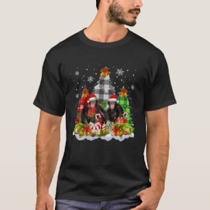 Een aap met gepaarde kerstbomen sneeuw die overeen t-shirt