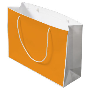 Een abstracte mix van levendig oranje, rood en gee groot cadeauzakje