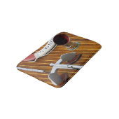 Een anker en een reddingsboei op een houten boot badmat (Gekanteld)