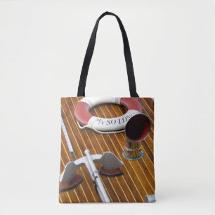 Een anker en een reddingsboei op een houten boot tote bag