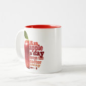 Een appel per dag tweekleurige koffiemok (Voorkant links)