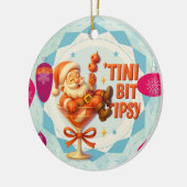 een beetje aangeschoten kerstman keramisch ornament (Links)