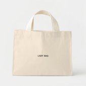 Een beige boodschappentas met witte handvatten mini tote bag (Voorkant)